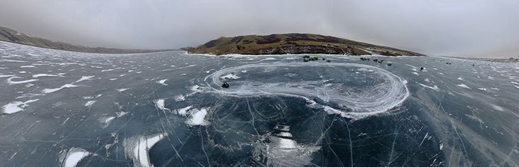 Aerial Unmanned Aerial Vehicle ( UAV )panoramic image of Huskie Formula Racing ( HFR ) ice racing their FSAE car on Blackstrap Lake 